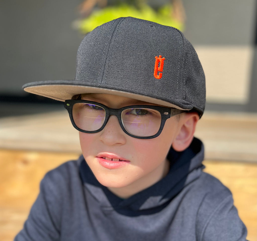 Classic Snapback Hat in black, side view, SEE 4 E XLRS awareness